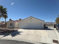 Charming single-story home with two-car garage and well-maintained landscaping at 7133 Tropical Island Cir, Las Vegas, NV 89129