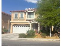 Charming two-story home with a two car garage, desert landscaping, and a red tile roof at 8494 Langhorne Creek St, Las Vegas, NV 89139
