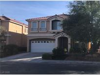 Charming two-story home with a well-maintained yard and attached two-car garage, and a red tile roof at 8494 Langhorne Creek St, Las Vegas, NV 89139