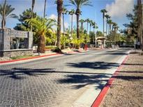 Gated community entrance featuring beautiful trees and landscaping at 9000 Las Vegas Blvd # 1029, Las Vegas, NV 89123