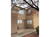 Charming two-story home with a private entrance and neutral-toned stucco at 574 Roxella Ln # C, Las Vegas, NV 89110