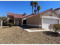 Charming single-story home featuring a low-maintenance xeriscape yard and a classic red tile roof at , Henderson, NV 89074