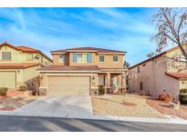 Charming two-story home with desert landscaping, two car garage, and a tile roof at 10332 George Hart Ct, Las Vegas, NV 89129