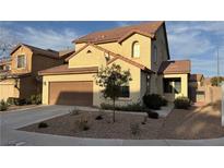 Charming two-story home features stucco siding, tiled roof, and an attached two-car garage at 1290 Corista Dr, Henderson, NV 89052