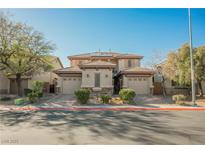 Charming home featuring a well-manicured front yard and attached two-car garages with a shared facade at 3717 Moonshine Falls Ave, North Las Vegas, NV 89085