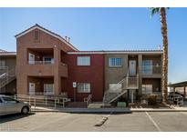 Exterior view of apartments featuring neutral paint and two-story buildings with stairway and parking at 4730 E Craig Rd # 2190, Las Vegas, NV 89115