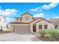 Charming two-story home with a well-manicured front yard and inviting entrance at 5124 Veeder Crest St, North Las Vegas, NV 89081