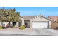 Charming single story home with a well maintained front yard and two car garage at 7912 Purple Mountain Ave, Las Vegas, NV 89131