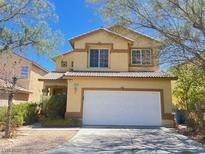 Charming two-story home featuring a two-car garage and well-maintained landscaping at 9299 Adamshurst Ave, Las Vegas, NV 89148