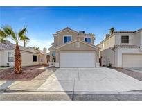 Charming two-story home showcasing desert landscaping and a spacious two-car garage at 1821 Cedar Bluffs Way, Las Vegas, NV 89128