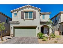 Charming two-story home with a brick driveway, two-car garage, and well-maintained landscaping at 6747 Marjoram St, Las Vegas, NV 89166