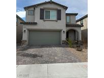 Charming two-story home featuring a neutral color palette, attached two-car garage, and a well-maintained front yard at 6747 Marjoram St, Las Vegas, NV 89166