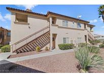 Inviting two-story condo with desert landscaping and a private entrance in a well-maintained community at 8501 W University Ave # 1002, Las Vegas, NV 89147
