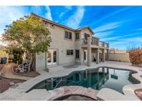 Beautiful backyard pool and patio with a built-in spa and plenty of space for entertaining at 1436 Via Merano St, Henderson, NV 89052