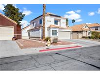 Charming two-story home with a well-manicured front yard and tile roof in a friendly neighborhood at 2108 Running River Rd, Henderson, NV 89074