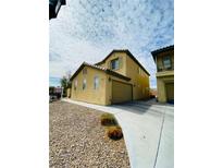 Charming two-story home featuring desert landscaping and an attached two-car garage at 3661 Hammock St, Las Vegas, NV 89147