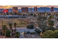 Aerial view of the home showcases nearby park and the vibrant Las Vegas skyline at 3731 Spencer St, Las Vegas, NV 89119