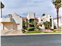 Stunning modern home showcasing a unique architectural design and lush landscaping at 42 Gulf Stream Ct, Las Vegas, NV 89113