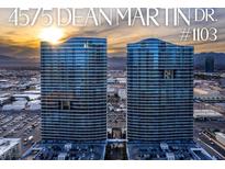 Stunning aerial view of luxury high-rise condos with city skyline and vibrant sunset in the background at 4575 Dean Martin Dr # 1103, Las Vegas, NV 89103