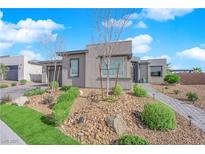 Charming single-story home featuring a desert landscape, paved walkway and a well-maintained front yard at 5095 E Long Leaf Ct, Pahrump, NV 89061