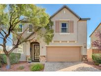 Charming two-story home features a neutral palette, well-manicured landscaping, and a two-car garage at 7018 Hunts Corner St, Las Vegas, NV 89166