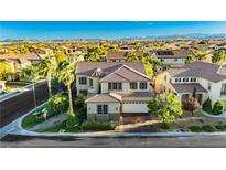 Expansive two-story home with desert landscaping, mountain views, and tile roof in quiet neighborhood at 7427 Tomahawk Bend Ave, Las Vegas, NV 89113