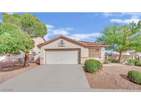 Charming single-story home featuring a well-maintained front yard and a spacious two-car garage at 7608 Sierra Paseo Ln, Las Vegas, NV 89128