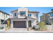 Inviting two-story home with a modern design, a two-car garage, and desert landscaping at 828 Parker Mesa St, Las Vegas, NV 89138