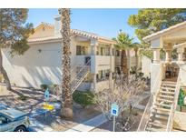 Inviting two-story condo with well-maintained landscaping and convenient parking at 929 Sulphur Springs Ln # 102, Las Vegas, NV 89128