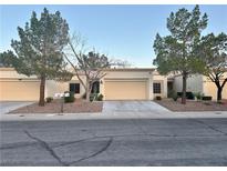 Charming single-story home featuring a well-kept lawn, mature trees, and a two-car garage at 2232 Spring Water Dr, Las Vegas, NV 89134