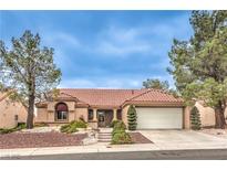Charming single-story home featuring a well-manicured front yard, desert landscaping, and a two-car garage at 2608 Golfside Dr, Las Vegas, NV 89134