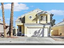 Charming two-story home with attached garage and desert landscaping at 3324 Altamar Ln, Las Vegas, NV 89117