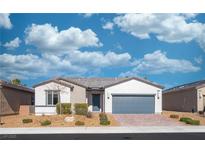 Charming single-story home with desert landscaping and a gray two car garage door at 4400 E Cactus Canyon Dr, Pahrump, NV 89061