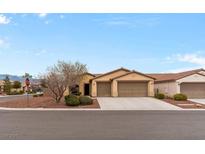Charming single-story home with a three-car garage and desert landscaping at 4755 Rossini St, Pahrump, NV 89061