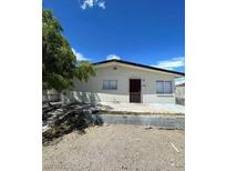 Charming single-story home featuring a well-maintained front yard and classic architectural details at 5128 Forrest Hills Ln, Las Vegas, NV 89108