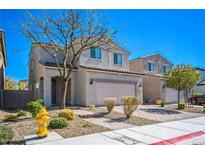 Charming two-story home with desert landscaping, attached two-car garage, and a welcoming front entrance at 5628 Ridgeland St, North Las Vegas, NV 89031
