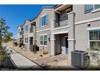 Attractive townhome showcases a private porch entry and manicured desert landscaping at 644 Bellus Pl # Lot 180, Henderson, NV 89015