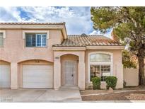 Charming two-story home with tile roof, desert landscaping, and attached one car garage at 8469 Sewards Bluff Ave, Las Vegas, NV 89129
