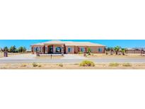 Spacious single-story home featuring well-maintained landscaping and a circular driveway at 1440 Lost Creek Dr, Pahrump, NV 89048