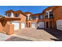 Mediterranean-style townhome with brick driveway and multiple car garages in a gated community at 16 Via Visione # 102, Henderson, NV 89011