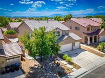 Two-story home showcasing manicured landscaping and a two-car garage at 2305 Dalton Ridge Ct, North Las Vegas, NV 89031
