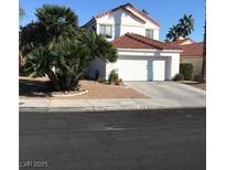 Charming two-story home featuring a well maintained yard, two car garage, and a classic red tile roof at 2720 Knightsbridge Rd, Henderson, NV 89074