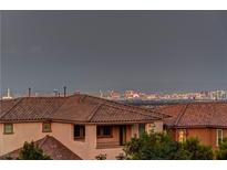 Enjoy breathtaking city views from this home, enhanced by a terracotta tile roof and neutral stucco exterior at 426 Port Reggio St, Las Vegas, NV 89138