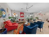 Bright living room showcasing modern decor, stylish furniture, and colorful accents, enhanced by natural light at 4514 Sapphire Moon Ave, North Las Vegas, NV 89084