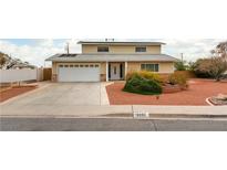 Traditional two-story home featuring solar panels, a two-car garage and desert landscaping at 4690 San Benito St, Las Vegas, NV 89121