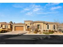 Beautiful single story home featuring manicured landscaping, neutral color palette, and tile roof at 50 Carolina Cherry Dr, Las Vegas, NV 89141