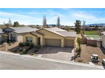 Stunning single-story home featuring a three-car garage and meticulously landscaped front yard in a vibrant community at 5467 Eleganza Ave, Pahrump, NV 89061