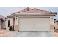 Charming single-story home featuring a well-maintained front yard and attached two-car garage at 6445 Glory Rise Ct, Las Vegas, NV 89142