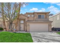 Charming two-story home with a well-maintained lawn and desert landscaping in a residential neighborhood at 7213 Buglehorn St, Las Vegas, NV 89131