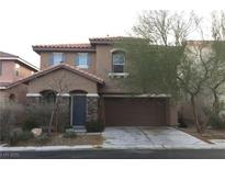 Charming two-story home with a two-car garage and landscaped front yard at 8749 Brilliant Star Dr, Las Vegas, NV 89178